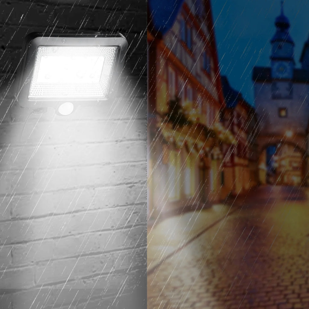 Solar motion sensor wall light illuminating an outdoor walkway