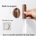 Magnetic night light mounted on an indoor wall