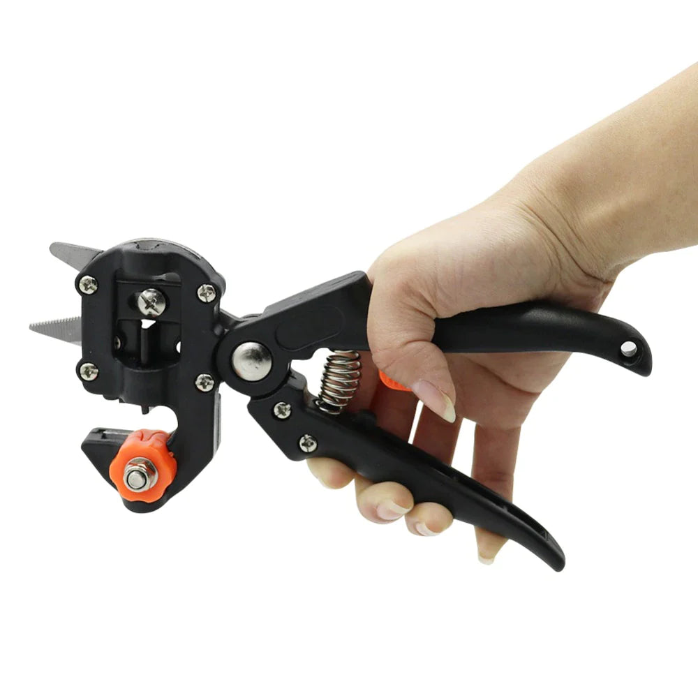 Hand holding garden grafting and pruning tool