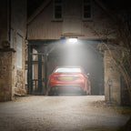 Solar motion sensor light illuminating an outdoor driveway